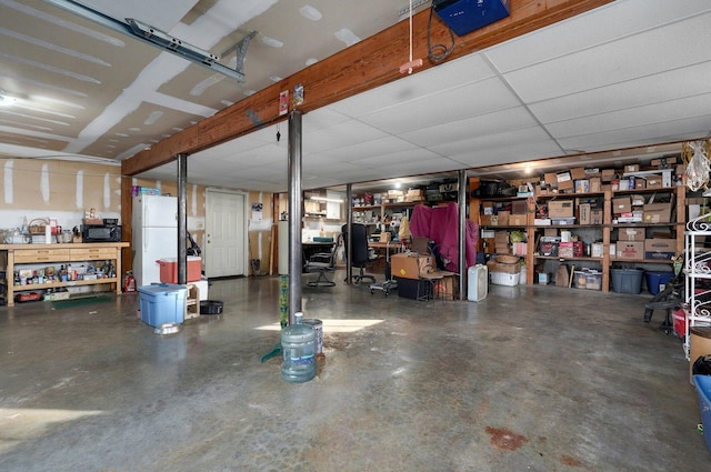 garage featuring white fridge