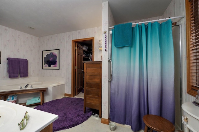 bathroom with vanity and separate shower and tub