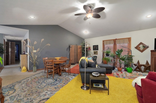 carpeted living room with ceiling fan and lofted ceiling