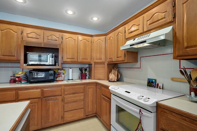 kitchen with decorative backsplash and electric stove