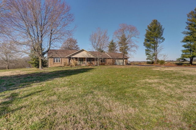 ranch-style home with a front lawn