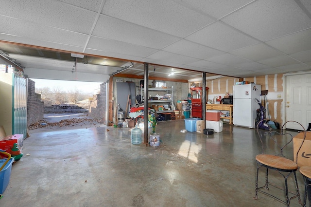 garage featuring white fridge