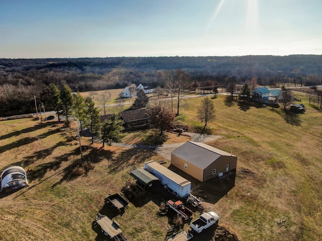 birds eye view of property with a rural view