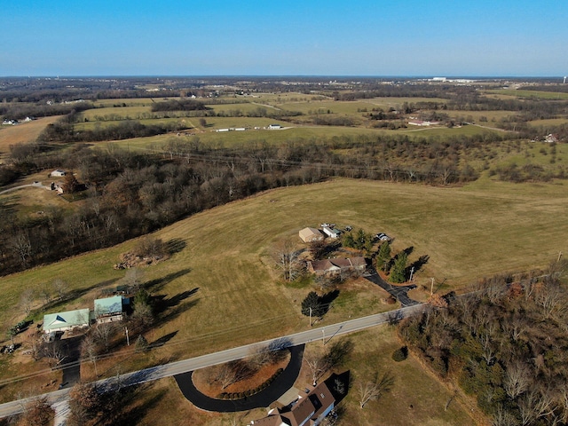 birds eye view of property featuring a rural view