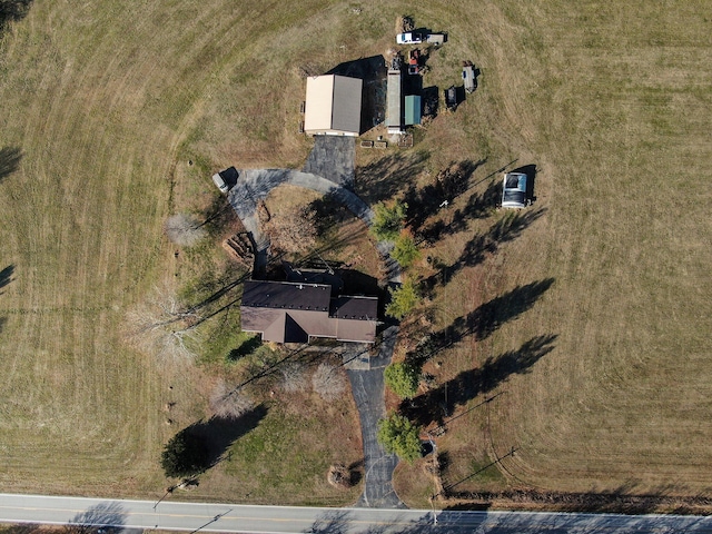 birds eye view of property with a rural view