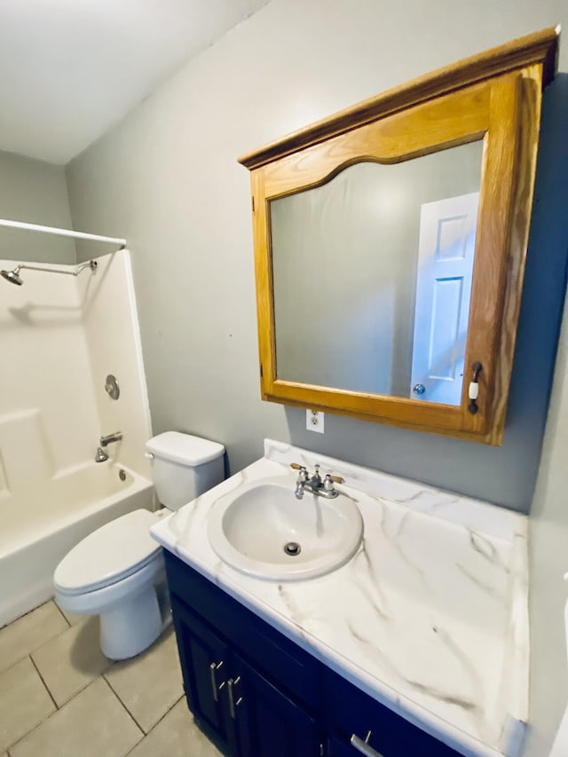 full bathroom with tile patterned floors, toilet, vanity, and washtub / shower combination