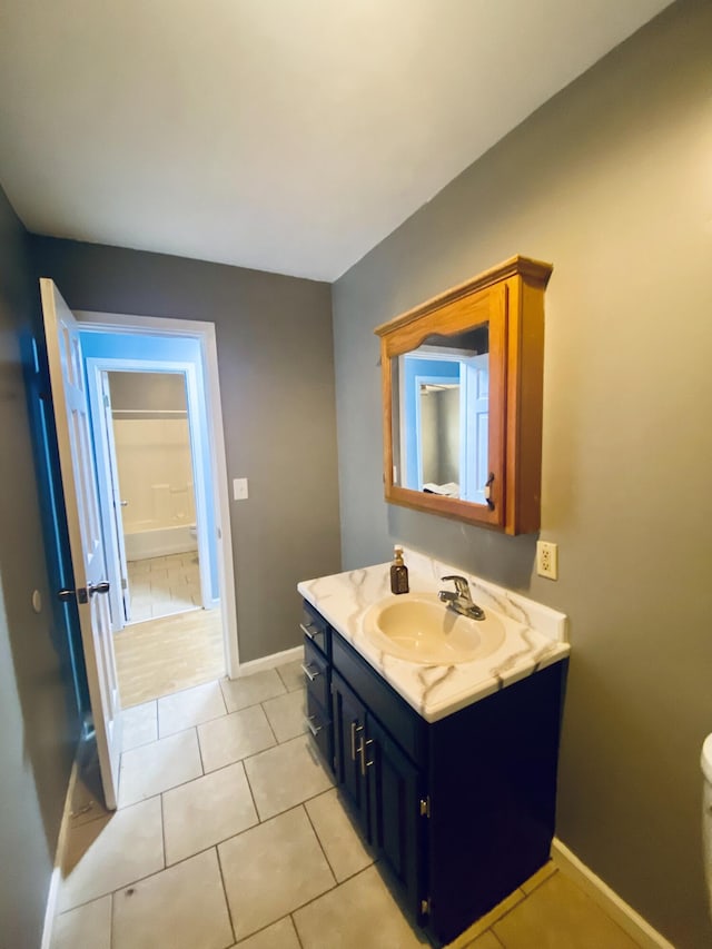 bathroom with vanity and tile patterned floors