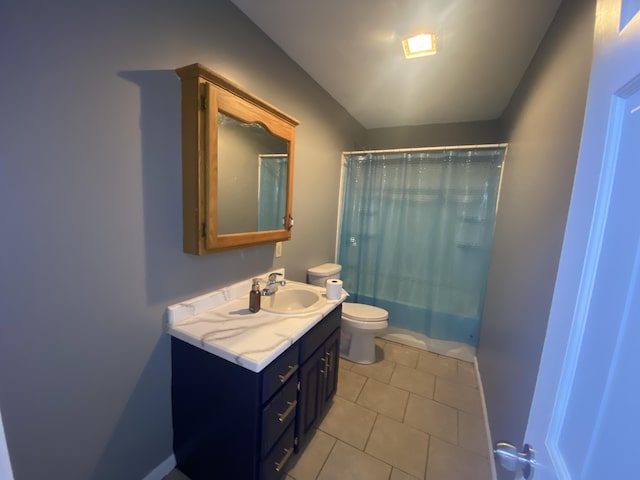 full bathroom featuring tile patterned floors, vanity, toilet, and shower / tub combo with curtain