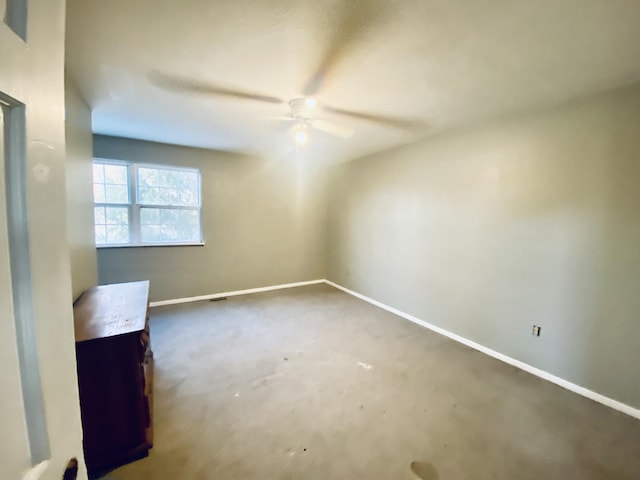 unfurnished room with ceiling fan