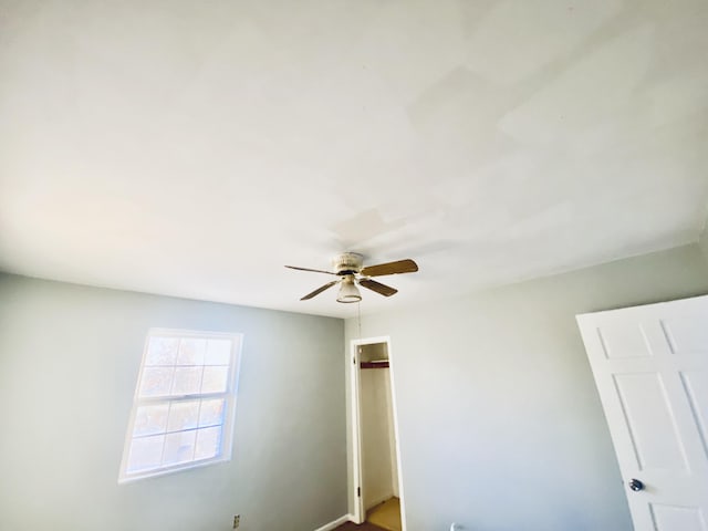 unfurnished room featuring ceiling fan