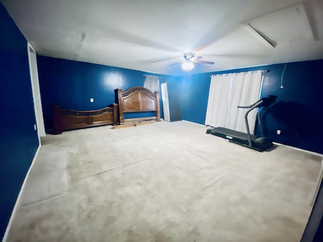 unfurnished bedroom with ceiling fan and carpet floors