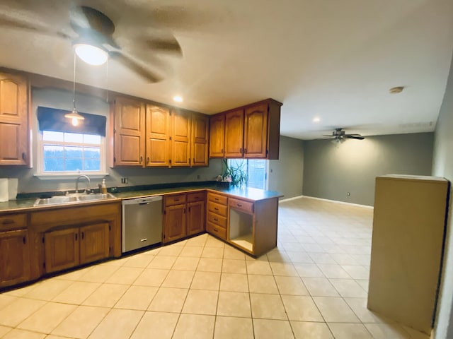 kitchen with dishwasher, sink, hanging light fixtures, kitchen peninsula, and light tile patterned floors