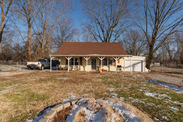 view of front of property featuring a porch and a garage