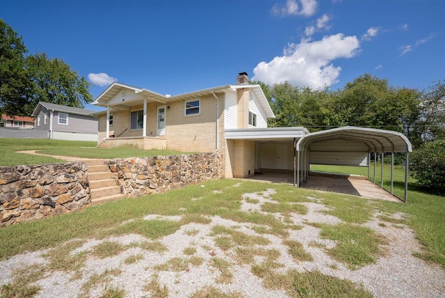 exterior space featuring a front yard, a porch, and a carport