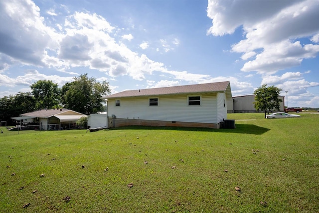 rear view of house with a yard