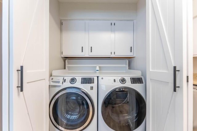 1610 Good Hard Dr, West Plains, MO 65775 - laundry room featuring washing machine and clothes dryer and cabinet space