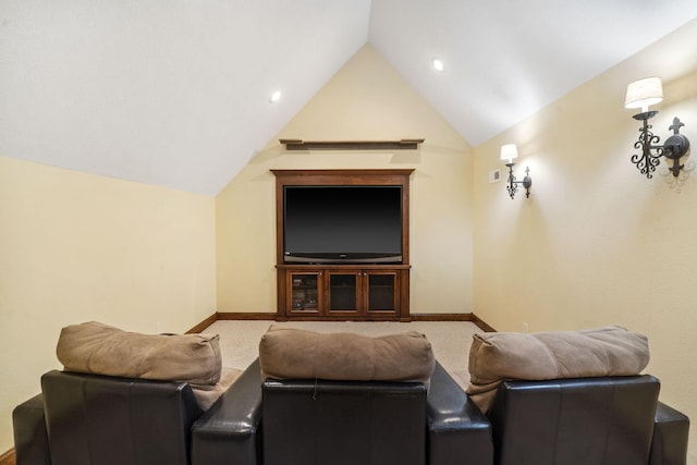 cinema room with carpet and lofted ceiling