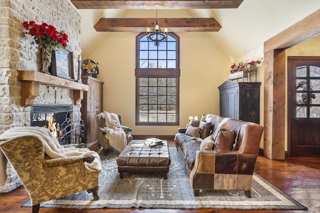 sitting room with vaulted ceiling with beams, a fireplace, dark hardwood / wood-style floors, and an inviting chandelier