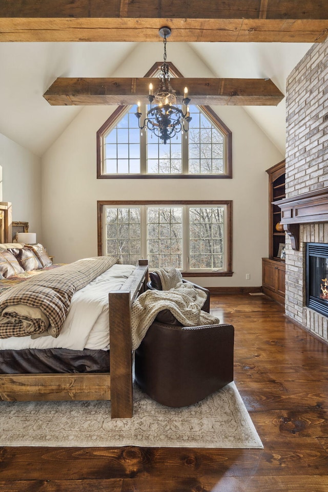 bedroom with dark hardwood / wood-style flooring, a brick fireplace, high vaulted ceiling, beamed ceiling, and a chandelier