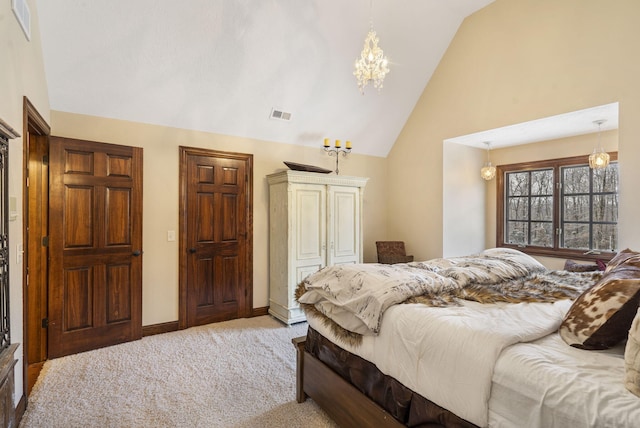 carpeted bedroom featuring lofted ceiling