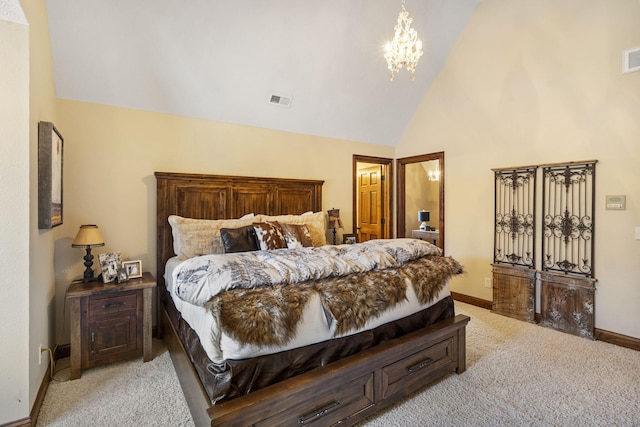 bedroom with a chandelier, high vaulted ceiling, and light colored carpet