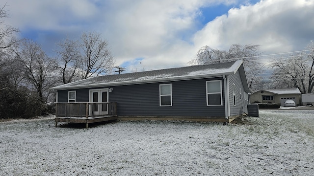 back of house featuring central air condition unit, french doors, and a deck