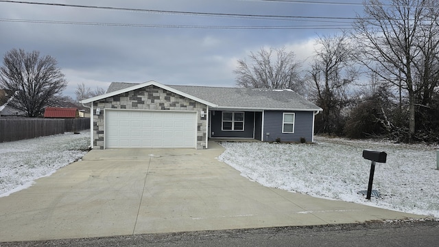 ranch-style house featuring a shingled roof, fence, a garage, stone siding, and driveway