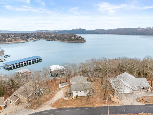 birds eye view of property with a water view