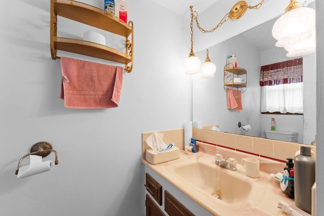 half bathroom with toilet, backsplash, and vanity