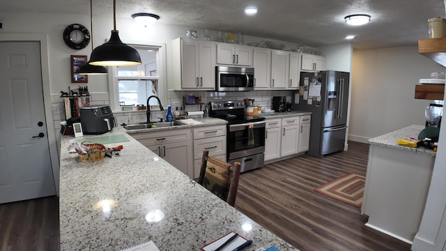 1247 State Hwy N, Clever, MO 65631 - kitchen with stainless steel appliances, dark wood-style floors, decorative backsplash, light stone countertops, and recessed lighting