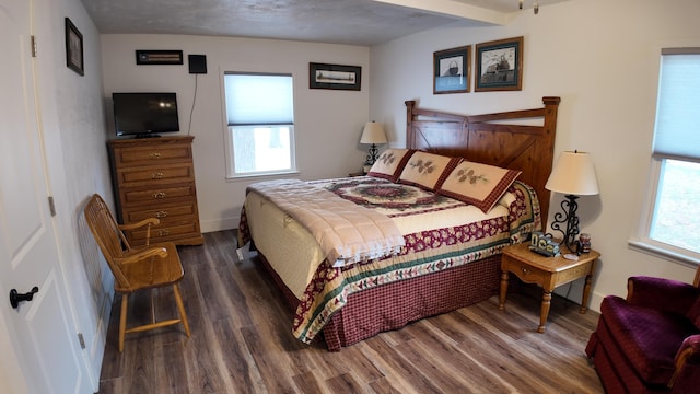 bedroom featuring dark hardwood / wood-style flooring