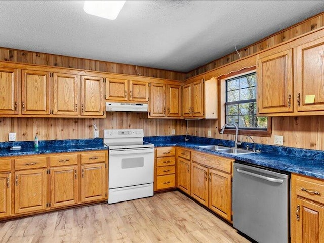 kitchen with white electric range, a textured ceiling, stainless steel dishwasher, and sink