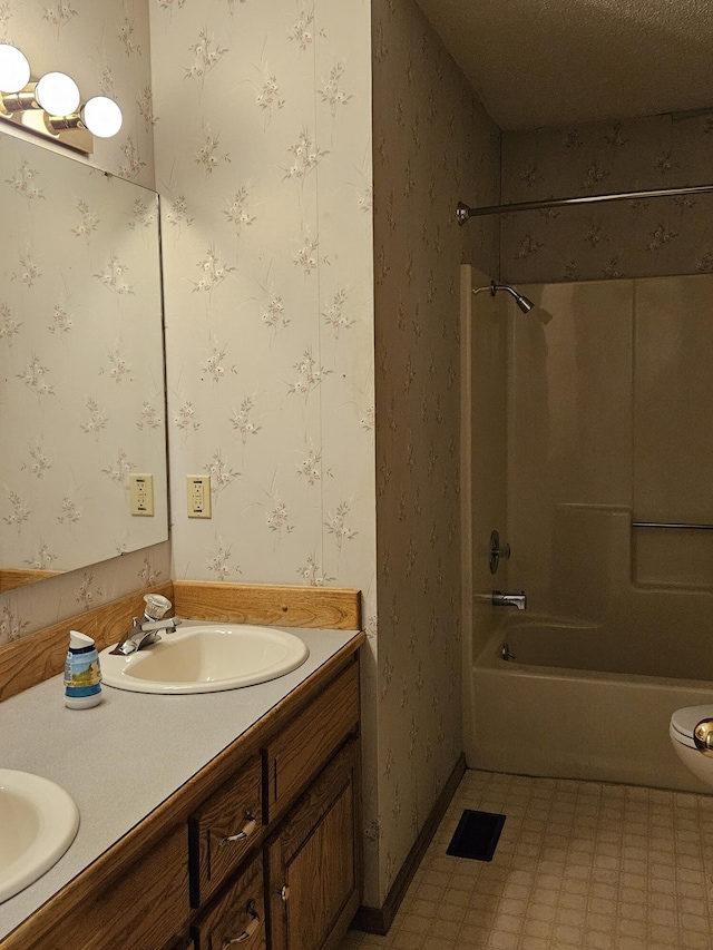 bathroom with vanity and shower / bathing tub combination