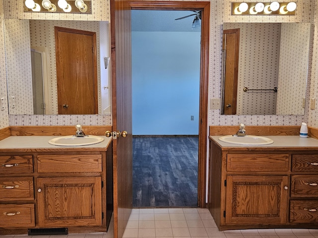 bathroom featuring tile patterned floors and vanity