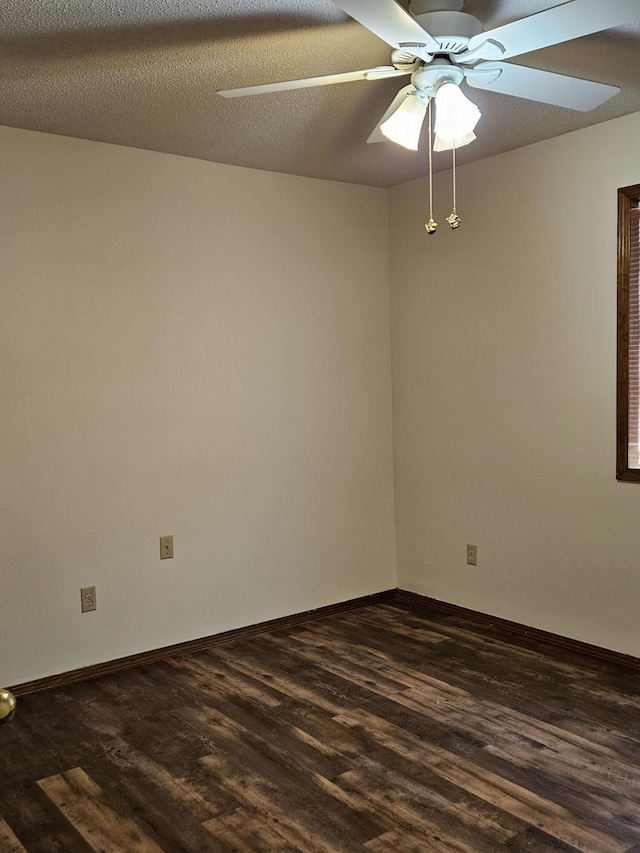 spare room featuring a textured ceiling, dark hardwood / wood-style floors, and ceiling fan