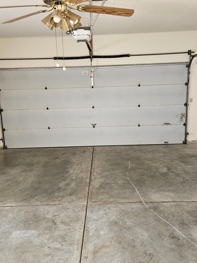 garage with ceiling fan and a garage door opener