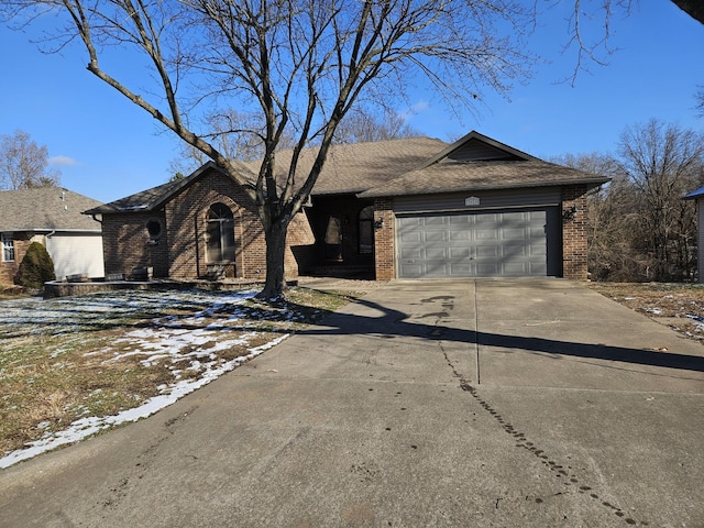 single story home featuring a garage