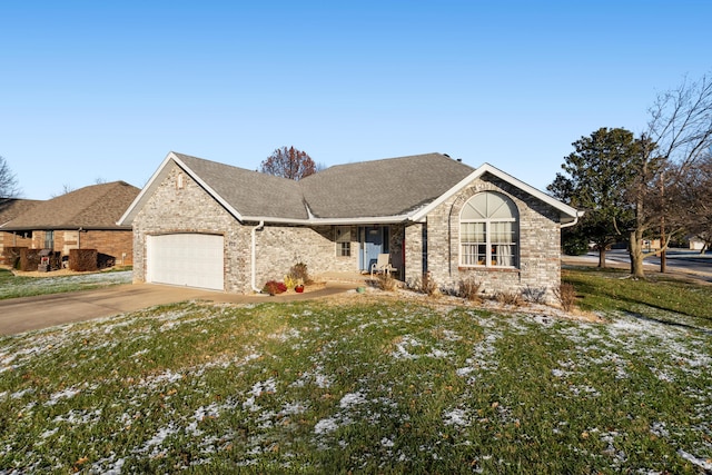 view of front of house with a garage and a front lawn