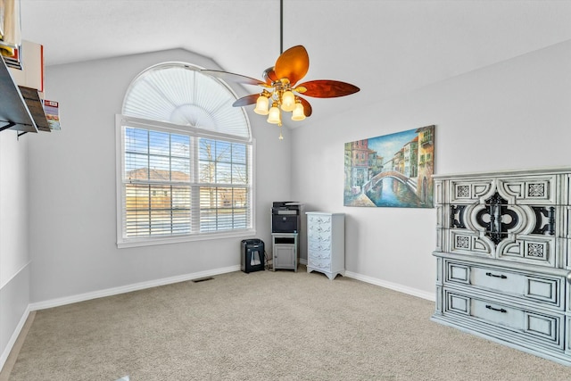 misc room with lofted ceiling, ceiling fan, and carpet floors