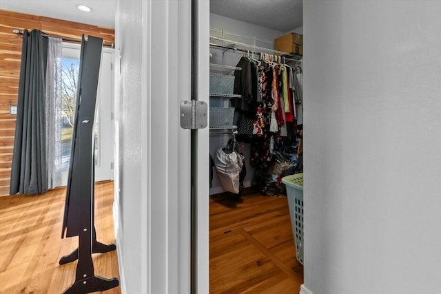 spacious closet with hardwood / wood-style floors