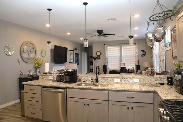 kitchen with gray cabinetry, ceiling fan, sink, hanging light fixtures, and appliances with stainless steel finishes