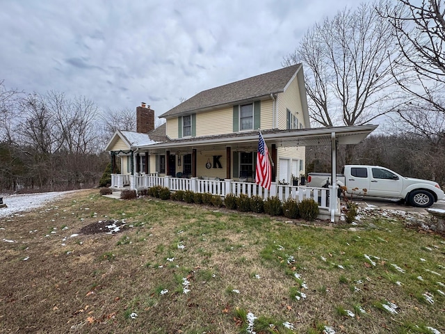 view of front facade featuring a porch and a front lawn