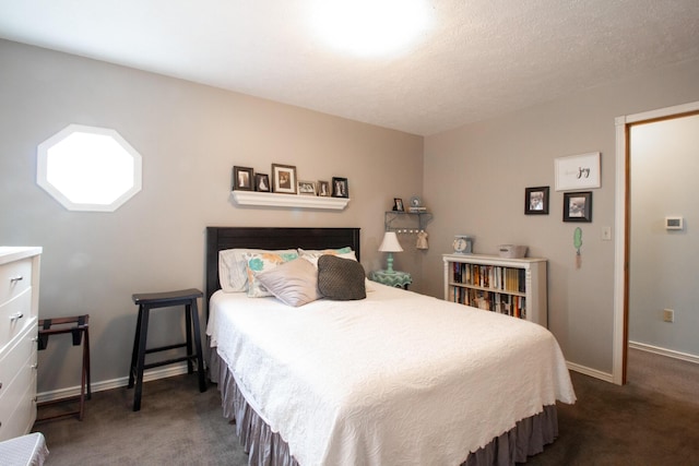 bedroom with dark colored carpet