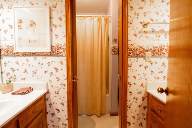 bathroom with vanity and a textured ceiling