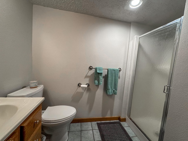 bathroom featuring walk in shower, tile patterned floors, toilet, a textured ceiling, and vanity