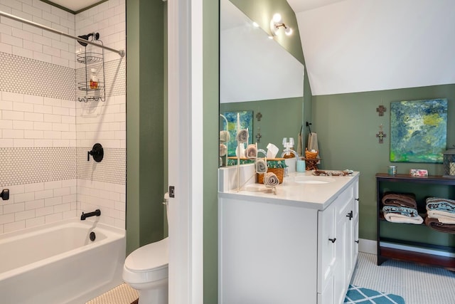 full bathroom featuring tiled shower / bath, tile patterned flooring, vanity, and toilet