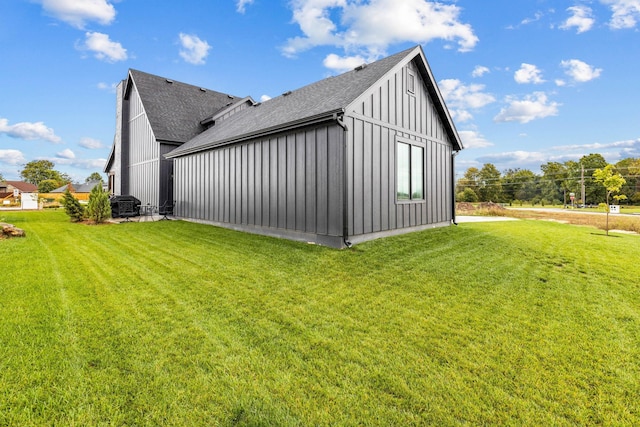 view of side of property with a yard