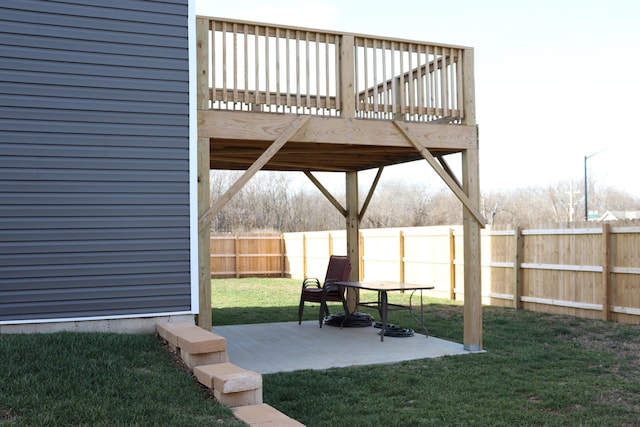 view of yard with a deck and a patio