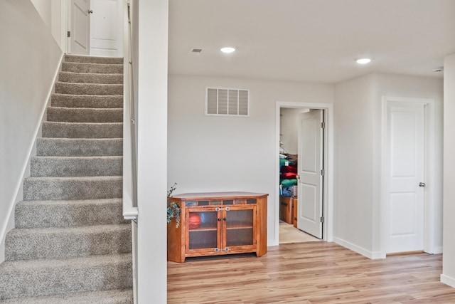 stairway with wood-type flooring