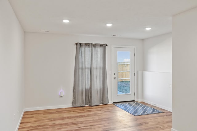 doorway to outside with light hardwood / wood-style floors